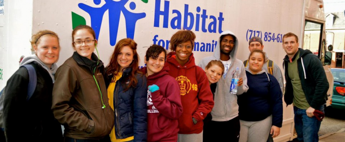 Students attend a Habitat Humanity service trip.